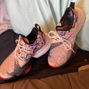 Dynamic Pink and Black Athletic Shoes with Reflective Knit